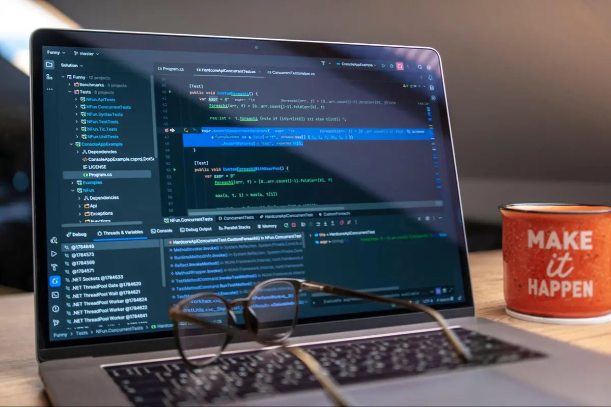 A developer reviewing infrastructure as code configuration files on a monitor in a modern office environment