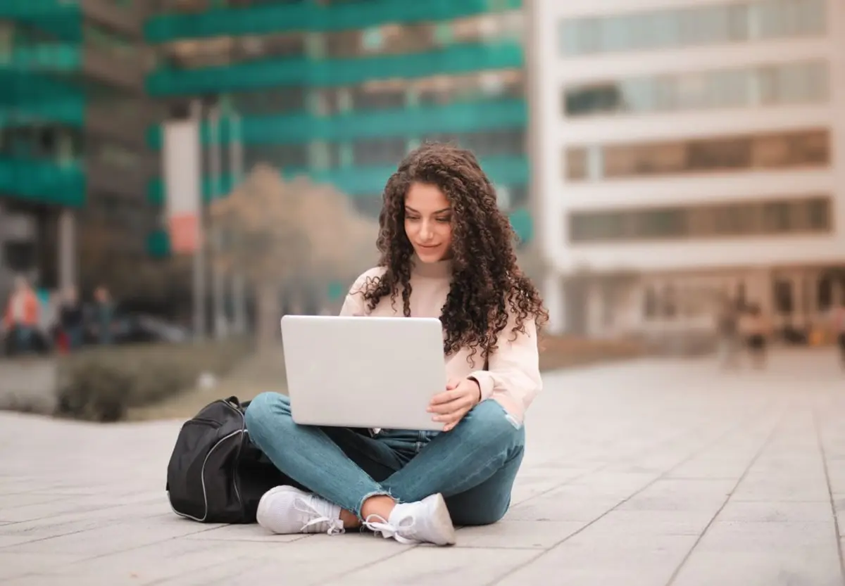 Students using laptops and tablets to access academic software remotely on a campus network